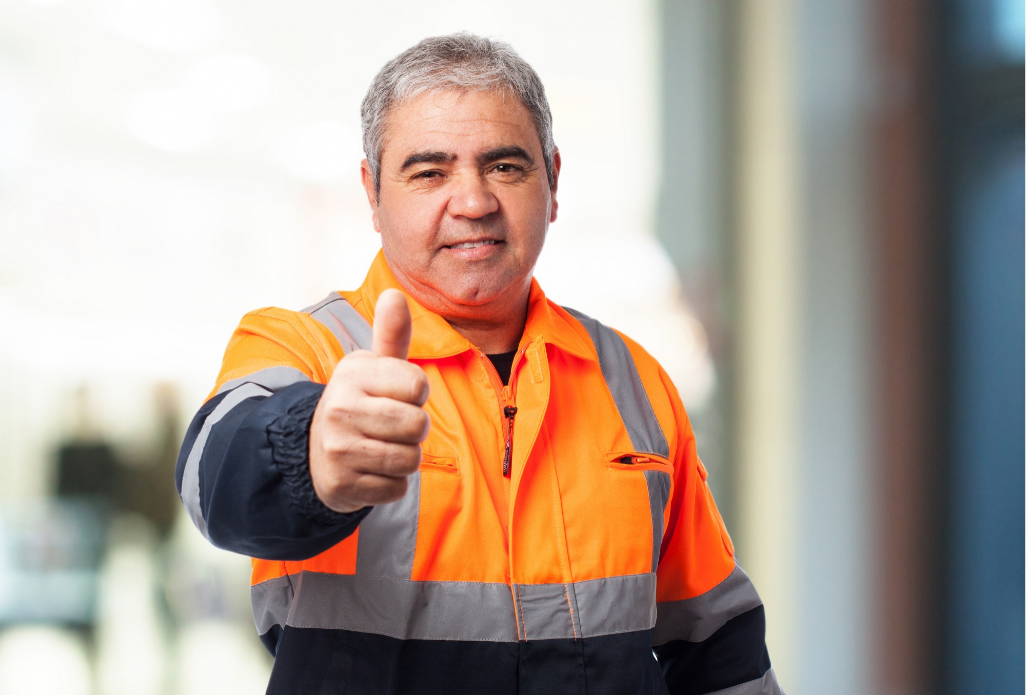 old man with reflective suit with thumb up