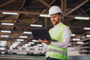 young man engineer working on factory