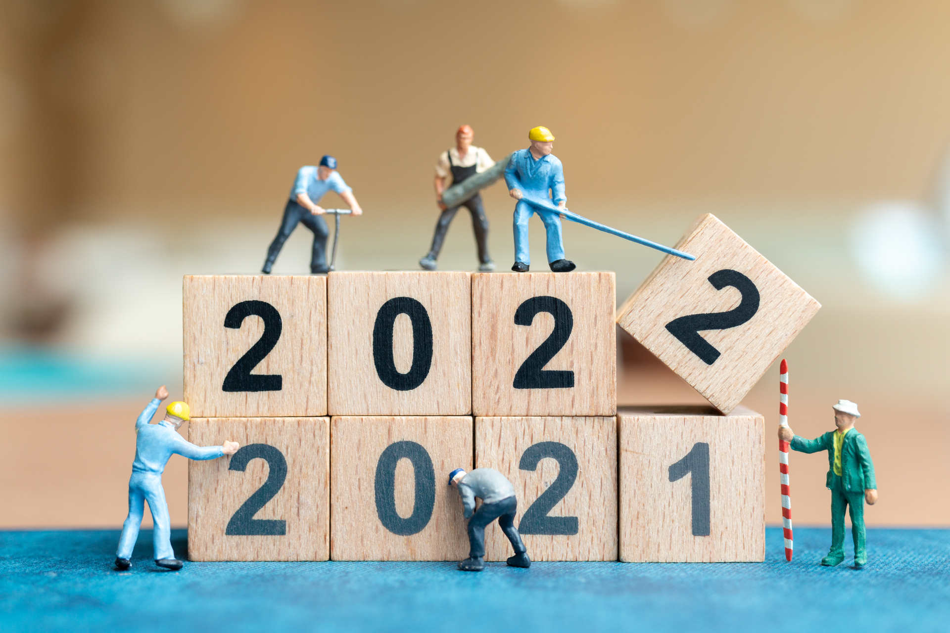 miniature people worker team create wooden block number 2022 happy new year concept 1920
