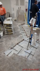 Lunacon reps assembling materials to pour and form concrete in art room min